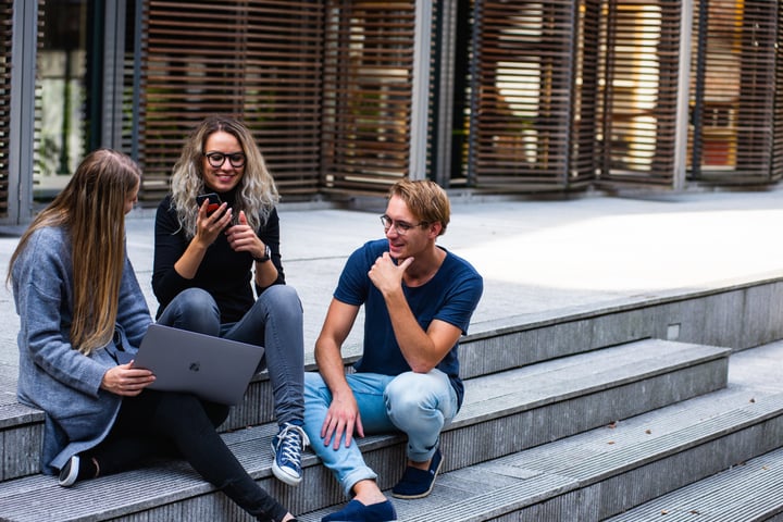 People working together outside on steps